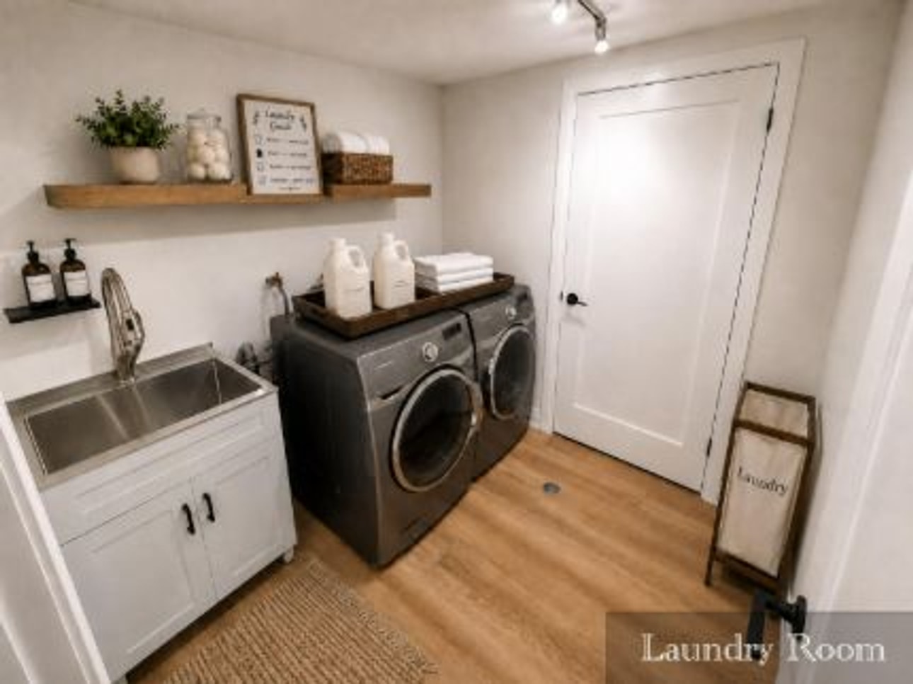 Finished laundry room with utility sink